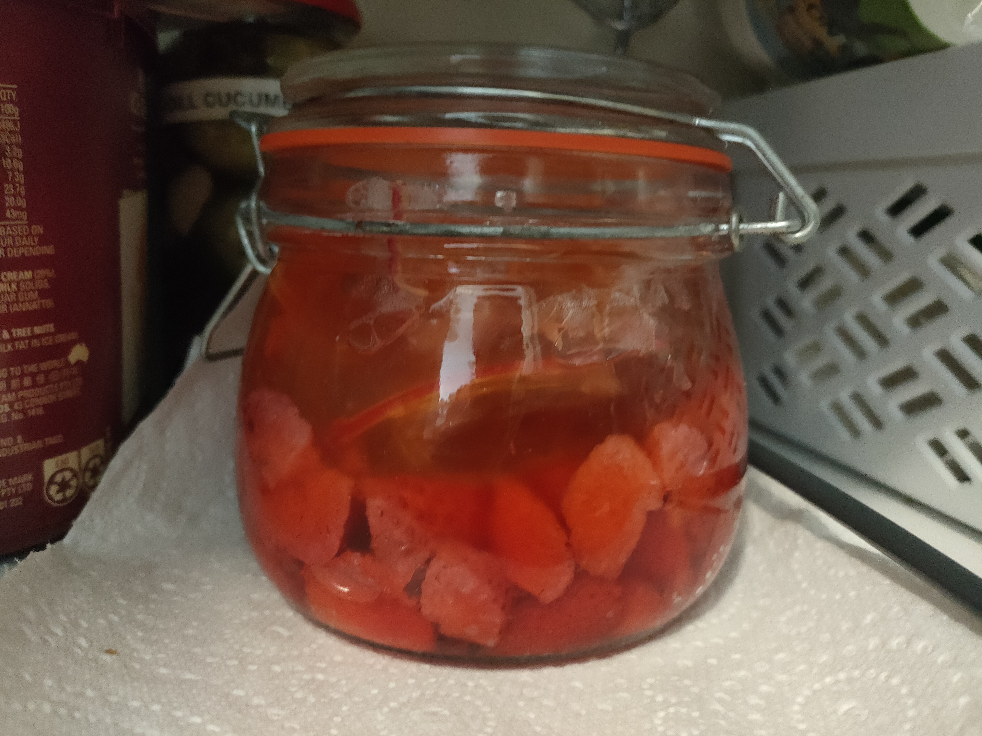 Chopped strawberries in a jar on day 2